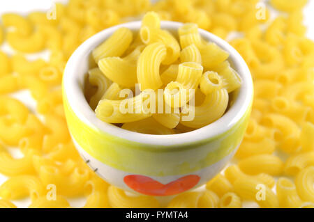 Elbow macaroni on white background Stock Photo