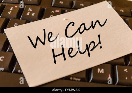 We can help Concept on keyboard note Stock Photo