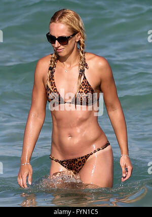 German tennis pro Sabine Lisicki wears a tiny leopard print bikini as she hangs out with Lilly Becker on the beach in Miami on Easter Weekend  Featuring: Sabine Lisicki Where: Miami Beach, Florida, United States When: 26 Mar 2016 Stock Photo