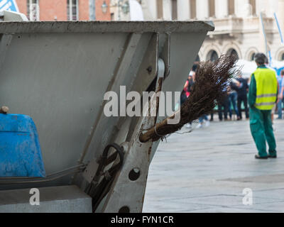 Municipal Dustman Worker with Cleaning Tools in Public Streets Stock Photo