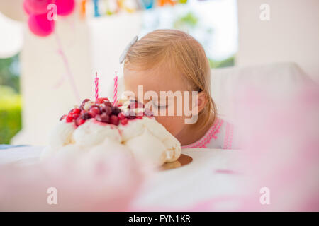 Cute Little Girl Eating Birthday Cake Stock Photo