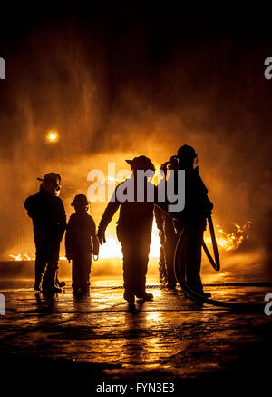 A child watching fire being put out Stock Photo