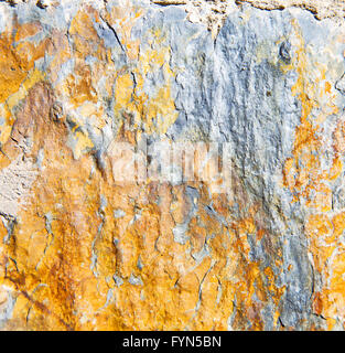 rocks stone and red orange gneiss in the wall of morocco Stock Photo