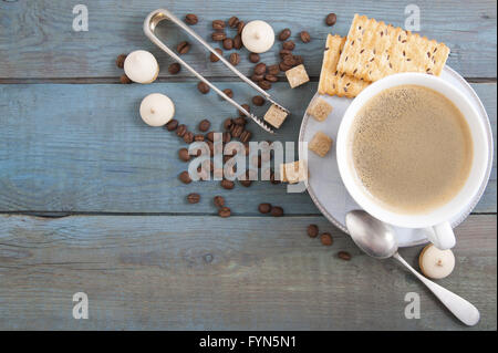 Cup of coffee on old wooden boards. Stock Photo