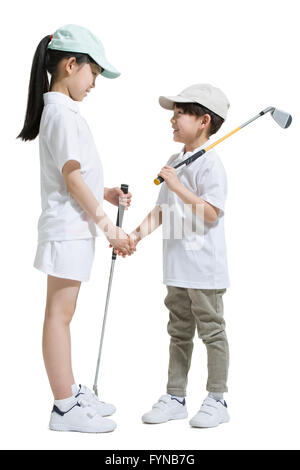 Cute children playing golf Stock Photo