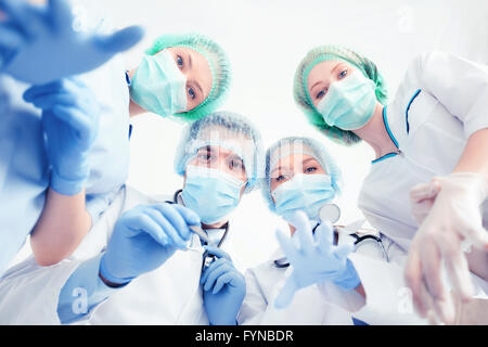 group of doctors in operating room Stock Photo