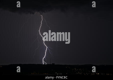 Lightning between clouds and earth Stock Photo