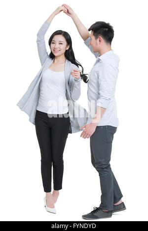 Happy young couple dancing Stock Photo