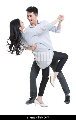 Happy young couple dancing Stock Photo
