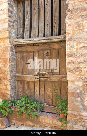 Ancient wooden door in an old Italian town. (Spello, Umbria, Italy) Stock Photo