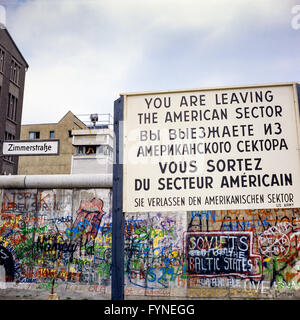 August 1986, leaving American sector warning sign, Berlin Wall graffitis, East Berlin watchtower, Zimmerstrasse street sign, West Berlin, Germany, Europe Stock Photo