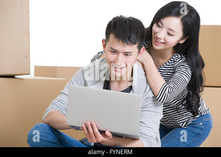 Young couple using laptop Stock Photo
