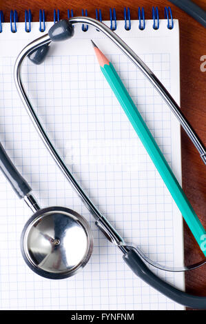 stethoscope with pen on a notepad Stock Photo