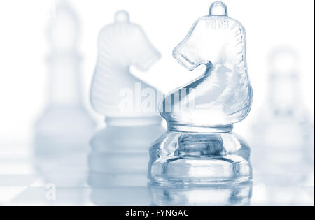 transparent glass chess pieces isolated on white Stock Photo