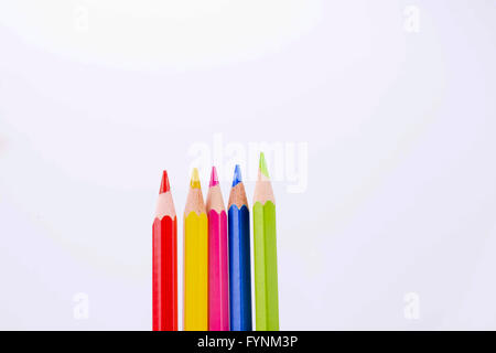five colorful pencils on a white background Stock Photo