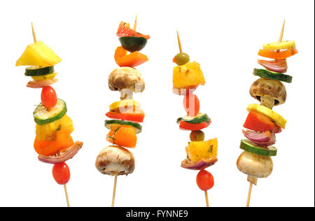 Delicious vegetarian veggie kebabs on skewers over a  white background Stock Photo