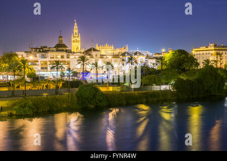 Seville is divided in two by the river Guadalquivir. On the east side it is located the cathedral and its tower called Giralda. Stock Photo