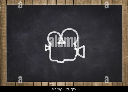 movie camera icon on chalkboard Stock Photo