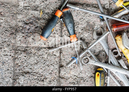 spanners and screwdrivers on the ground Stock Photo
