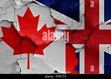 flags of Canada and UK painted on cracked wall Stock Photo