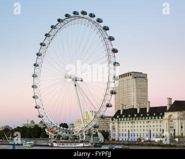 London Eye ferris wheel on bank of Thames Stock Photo