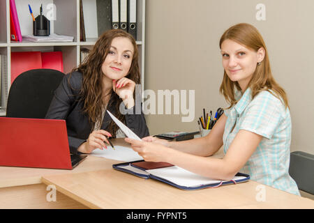 Girl shows resume employer Stock Photo