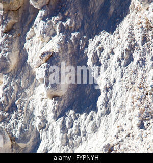 dirty  stone in italy white gray rock surface  mineral and texture Stock Photo