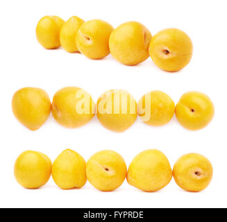 Lined up yellow plums isolated Stock Photo