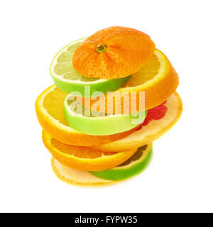Stack of citrus sliced fruits over white isolated background Stock Photo