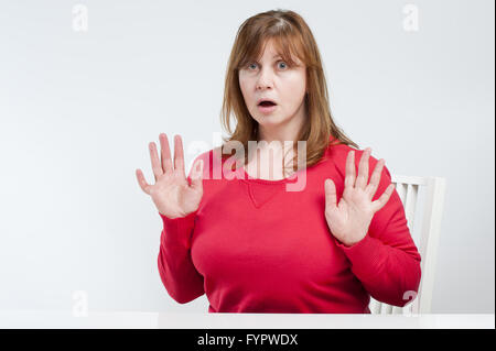 Frightened middle-aged woman. Stock Photo