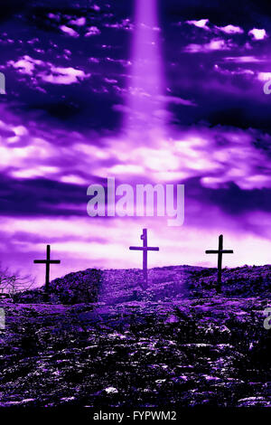 Three wooden crosses on a hill with holy light glow Stock Photo