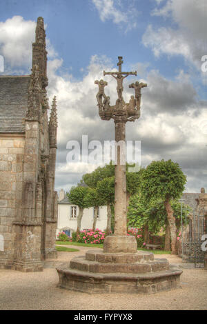 Cross at parish close in Lampaul Guimiliau, France. Stock Photo