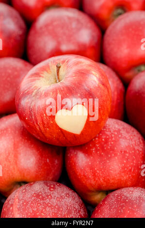 Apple with a heart shape cut-out Stock Photo