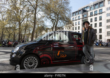 London, UK. 27 April 2016. Pictured: British-Israeli designer Ron Arad poses with his personal Fiat 500, with a 1:1 scale drawing of the 1957 model Cinquecento. The car will be auctioned off. The world's leading designers and artists come together for Time for Design, an auction in aid of the new Design Museum in London. Amongst the star lots are Bono's guitar and a special edition iPad Pro designed by Jony Ive of Apple. The benefit auction will be held at Phillips in London on 28 April 2016. All proceeds will go towards realising the Design Museum's ambition of creating the world's leading mu Stock Photo