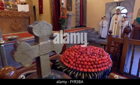 Armenian priests consecrate one hundred red eggs during the Easter mass ...