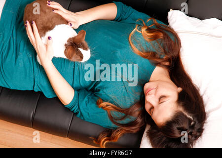 Caressing a rabbit Stock Photo