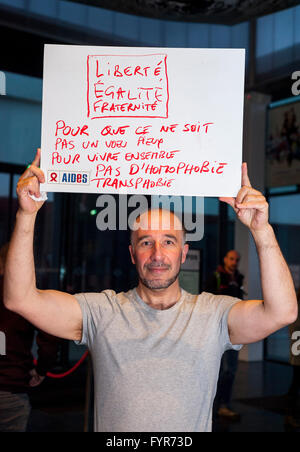 Paris, France, AIDS NGO AIDES Activists, French Man Holding Protest Signs Against Discrimination, Homophobia, social justice slogans Stock Photo