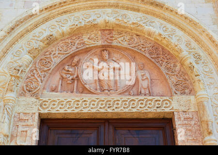 Decorative carvings above door to Cattedrale Di Assisi Umbria Italy Europe Stock Photo