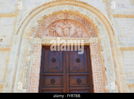 Decorative carvings above door to Cattedrale Di Assisi Umbria Italy Europe Stock Photo