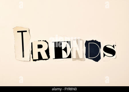 the word trends written with different letters made of clippings of newspapers and magazines, on an off-white background Stock Photo