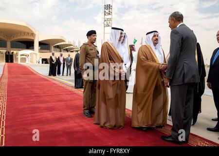 U.S President Barack Obama is greeted by Prince Faisal bin Bander bin Abdulaziz Al-Saud upon arrival at King Khalid International Airport April 20, 2016 in Riyadh, Saudi Arabia. Stock Photo