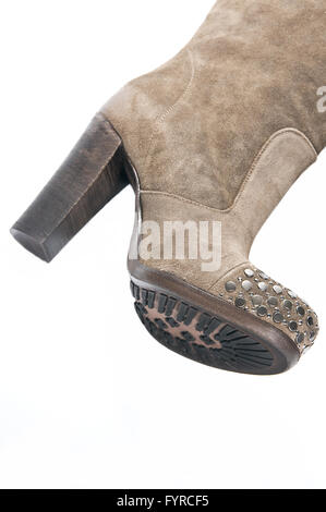 Women's beige suede high-heeled boots. Stock Photo