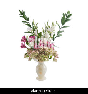 Bouquet of flowers in a vase made of onyx. Stock Photo