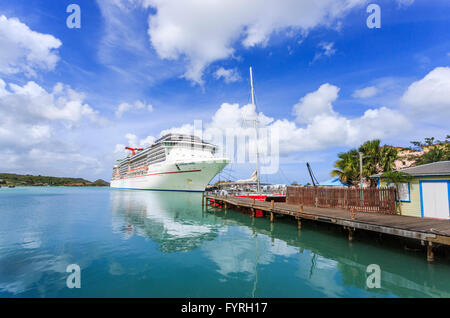 Cruise ship 'Carnival Pride' moored in St John's Deep Water Harbour, capital city, in the north of Antigua and Barbuda Stock Photo