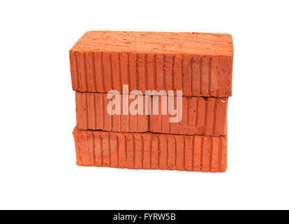 Stack of ordinary red bricks on white background Stock Photo