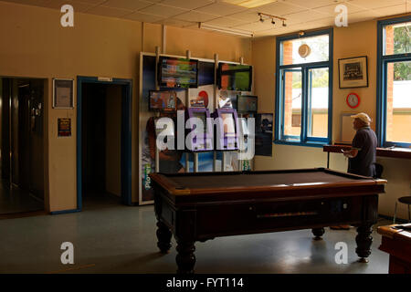 Man watching a horse race on television  in the Nannup Hotel, Nannup Western Australia Stock Photo