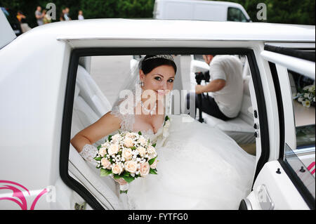 happy bride on wedding limousine Stock Photo