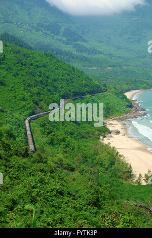 Panorama scene, Lang Co beach, Hue from Hai Van mountain pass at Da Nang, Viet Nam. Amazing landscape of train moving on railway Stock Photo