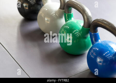 colorful kettle bell on table Stock Photo