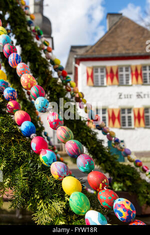 Easter tradition, decoration of the Maximilian fountain, in the old town of Arnsberg, Germany, with hand painted easter eggs Stock Photo